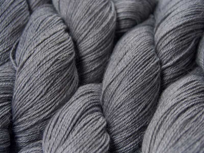 Light to mid neutral grey Baby Alpaca, silk and linen 4-ply yarn. Hand-dyed by Triskelion Yarn.