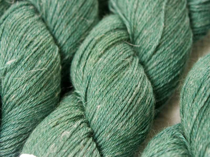 Mid-tone blue-green Baby Alpaca, silk and linen 4-ply yarn. Hand-dyed by Triskelion Yarn.