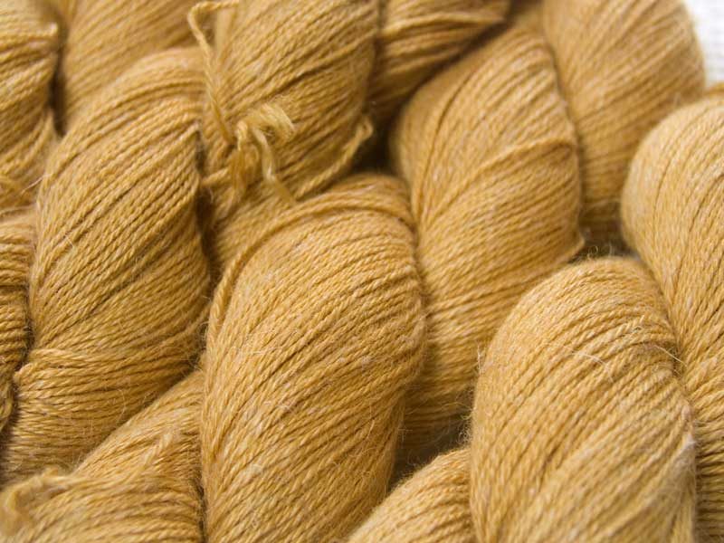 Gold Baby Alpaca, silk and linen 4-ply yarn. Hand-dyed by Triskelion Yarn.