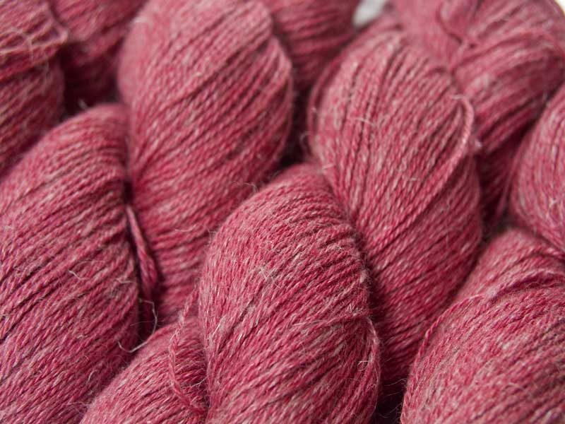 Semi-solid deep rose Baby Alpaca, silk and linen 4-ply yarn. Hand-dyed by Triskelion Yarn.
