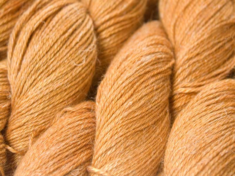 Saffron Baby Alpaca, silk and linen 4-ply yarn. Hand-dyed by Triskelion Yarn.