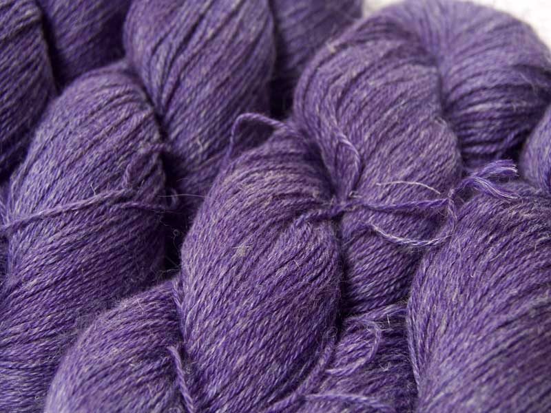 Semi-solid mid-tone purple Baby Alpaca, silk and linen 4-ply yarn. Hand-dyed by Triskelion Yarn.