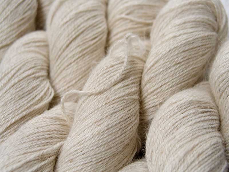 Undyed Baby Alpaca, silk and linen 4-ply yarn. Hand-dyed by Triskelion Yarn.