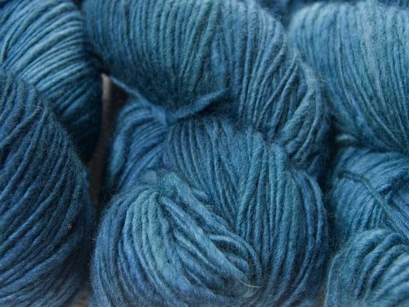 Semi-solid cerulean blue Corriedale thick and thin slub yarn. Hand-dyed by Triskelion Yarn.