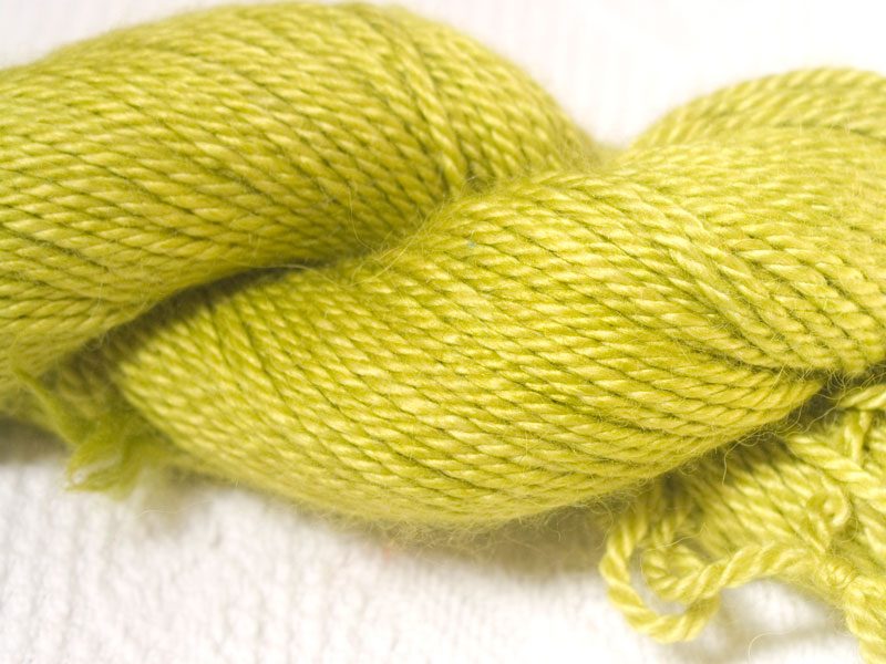 Semi-solid vibrant spring green baby alpaca / silk aran yarn. Hand-dyed by Triskelion Yarn.