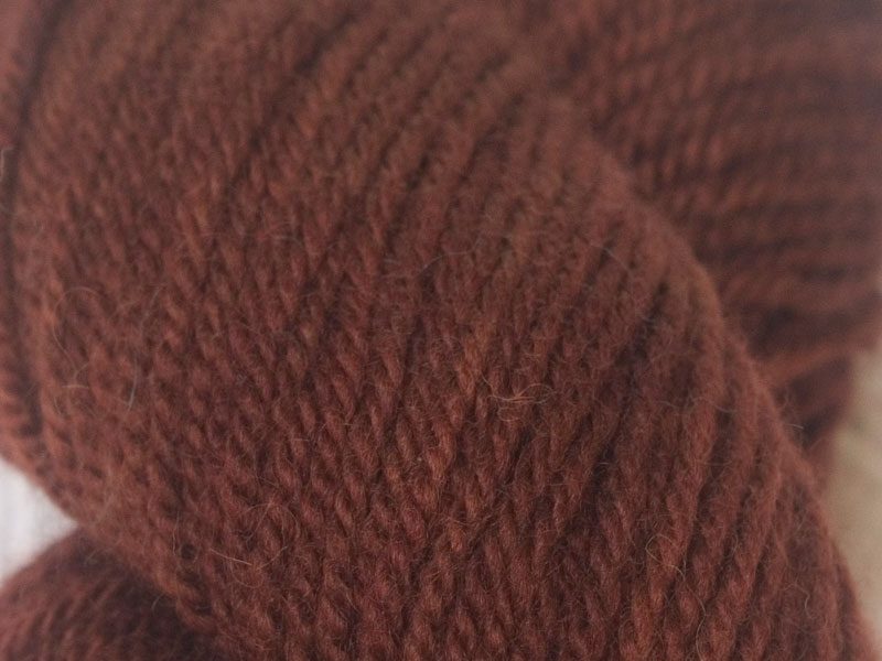 Rich, dark chestnut brown Bluefaced Leicester (BFL) double knit yarn. Hand-dyed by Triskelion Yarn