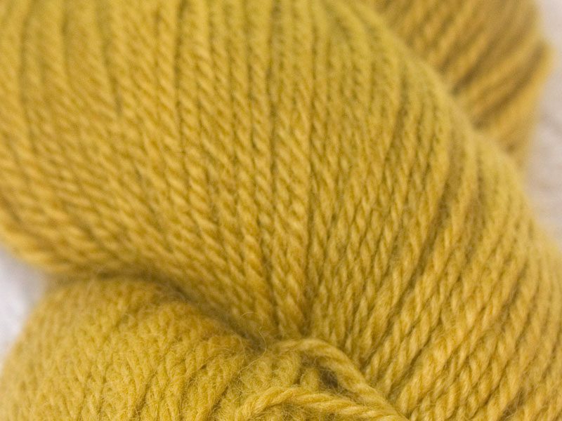 Light yellow Bluefaced Leicester (BFL) double knit yarn. Hand-dyed by Triskelion Yarn