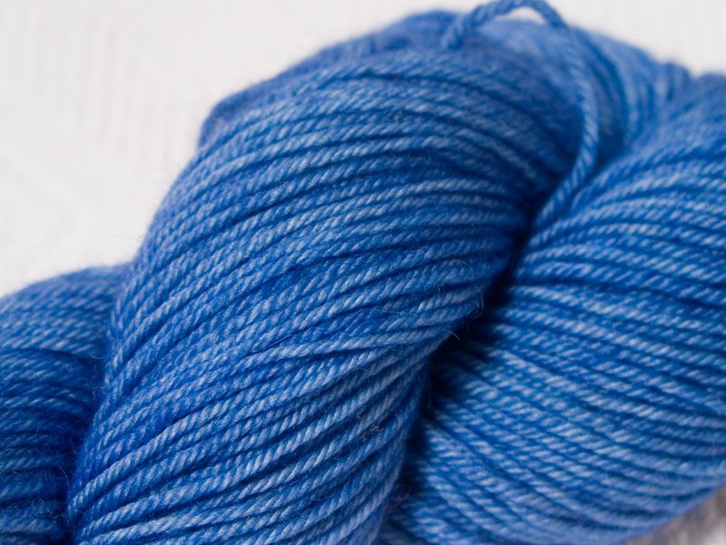 Blue superwash Bluefaced Leicester (BFL) double knit yarn. Hand-dyed by Triskelion Yarn