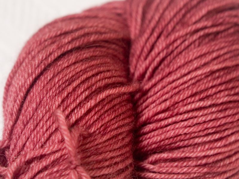 Rich mid-tone rose superwash Bluefaced Leicester (BFL) double knit yarn. Hand-dyed by Triskelion Yarn