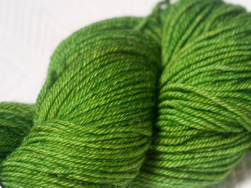 Green superwash Bluefaced Leicester (BFL) double knit yarn. Hand-dyed by Triskelion Yarn