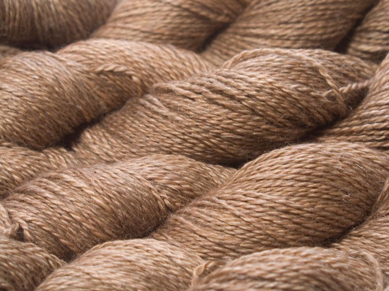 Light to mid brown (oak) Baby Alpaca, silk and linen sport weight yarn. Hand-dyed by Triskelion Yarn.