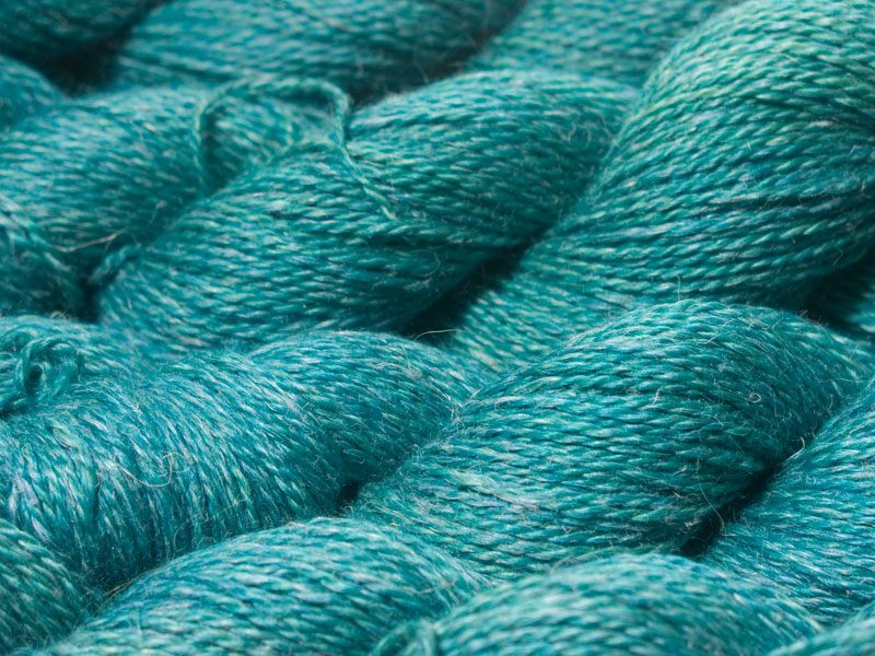 Mid-tone blue-green Baby Alpaca, silk and linen sport weight yarn. Hand-dyed by Triskelion Yarn.