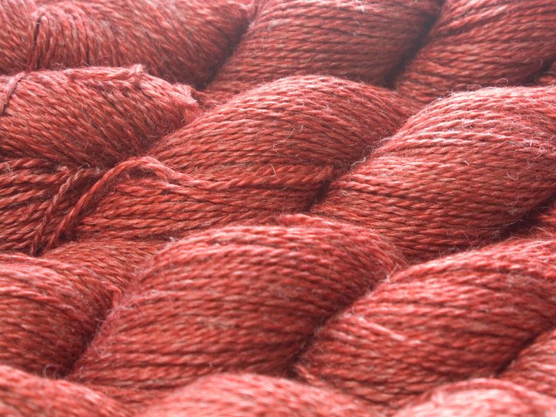 Fiery orange-red Baby Alpaca, silk and linen sport weight yarn. Hand-dyed by Triskelion Yarn.