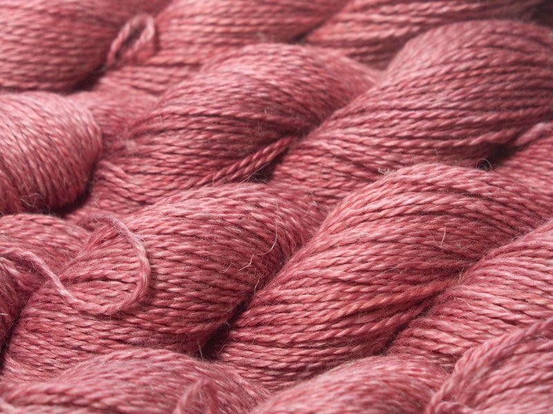 Semi-solid vibrant rose pink Baby Alpaca, silk and linen sport weight yarn. Hand-dyed by Triskelion Yarn.