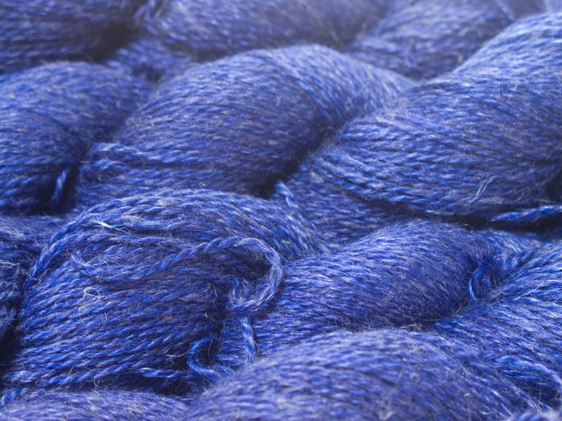 Semi-solid deep blue Baby Alpaca, silk and linen sport weight yarn. Hand-dyed by Triskelion Yarn.