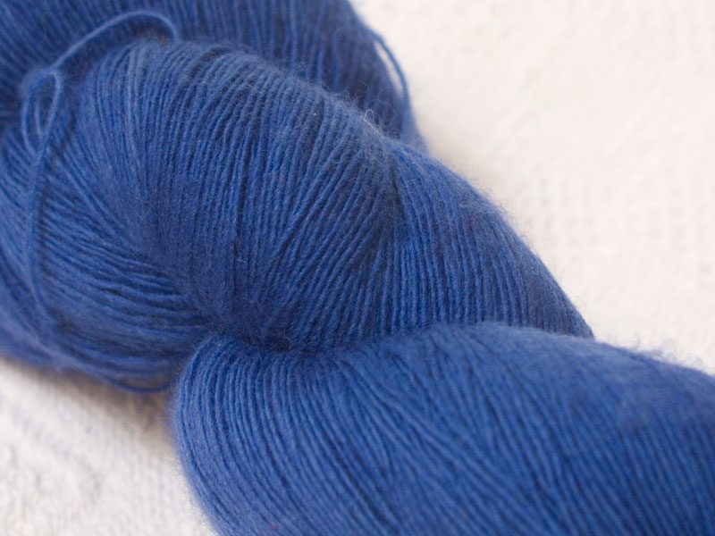Semi-solid deep blue Falklands Merino laceweight yarn hand-dyed by Triskelion Yarns
