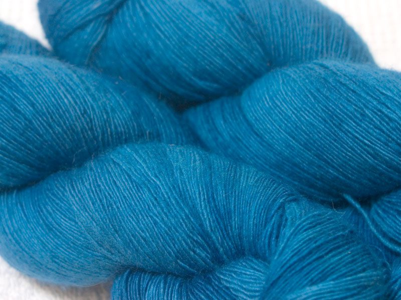 Semi-solid cerulean blue Falklands Merino laceweight yarn hand-dyed by Triskelion Yarns