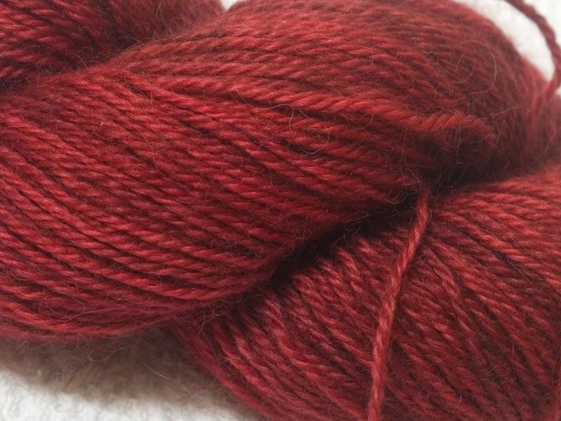 Red hand-dyed Wensleydale DK/ Double Knit yarn. Hand-dyed by Triskelion Yarn