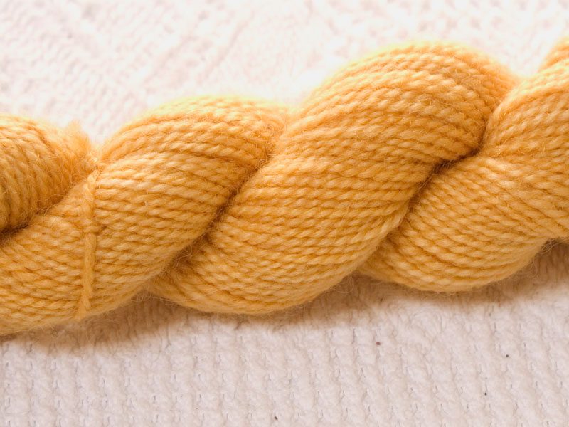 Beowa - Semi-solid golden yellow superwash Bluefaced Leicester (BFL) 4-ply/fingering/sock yarn mini skein. Hand-dyed by Triskelion Yarn