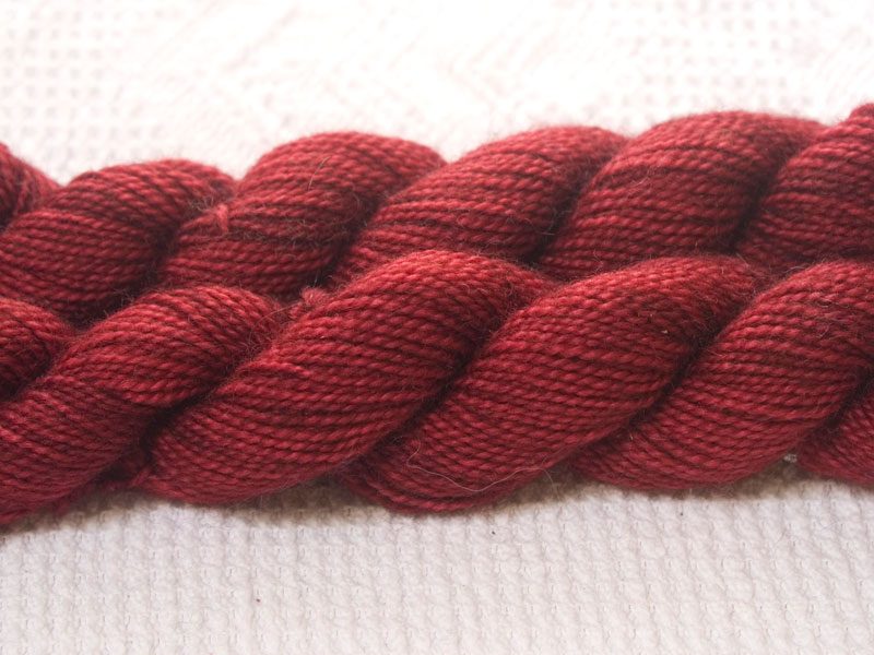 Bootes - Semi-solid deep red superwash Bluefaced Leicester (BFL) 4-ply/fingering/sock yarn mini skein. Hand-dyed by Triskelion Yarn