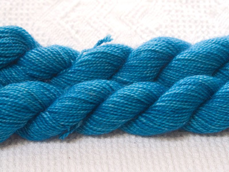Conn - Light to mid-tone sky blue superwash Bluefaced Leicester (BFL) 4-ply/fingering/sock yarn mini skein. Hand-dyed by Triskelion Yarn
