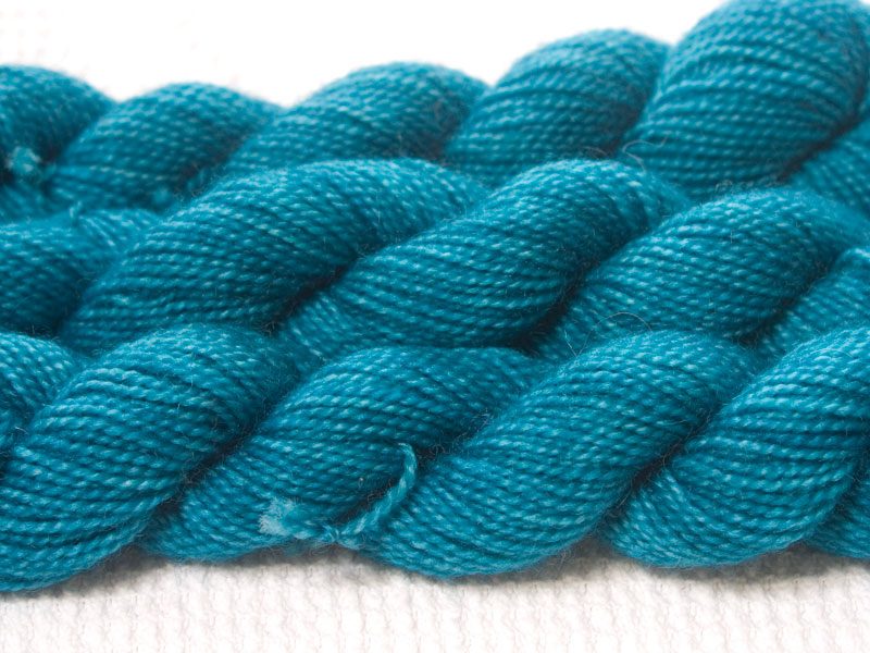 Fiachra - Mid-tone turquoise superwash Bluefaced Leicester (BFL) 4-ply/fingering/sock yarn mini skein. Hand-dyed by Triskelion Yarn