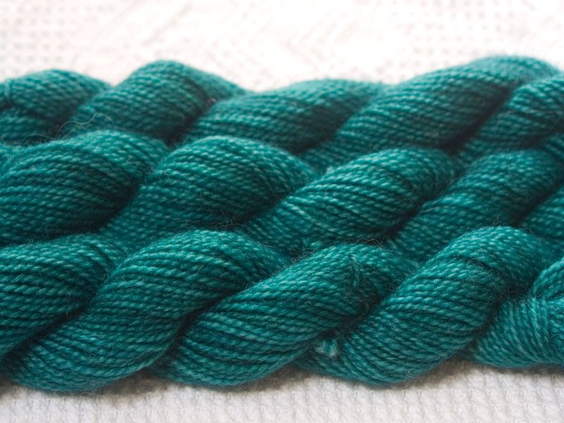 Fionnuala - Mid tone bluish green superwash Bluefaced Leicester (BFL) 4-ply/fingering/sock yarn mini skein. Hand-dyed by Triskelion Yarn