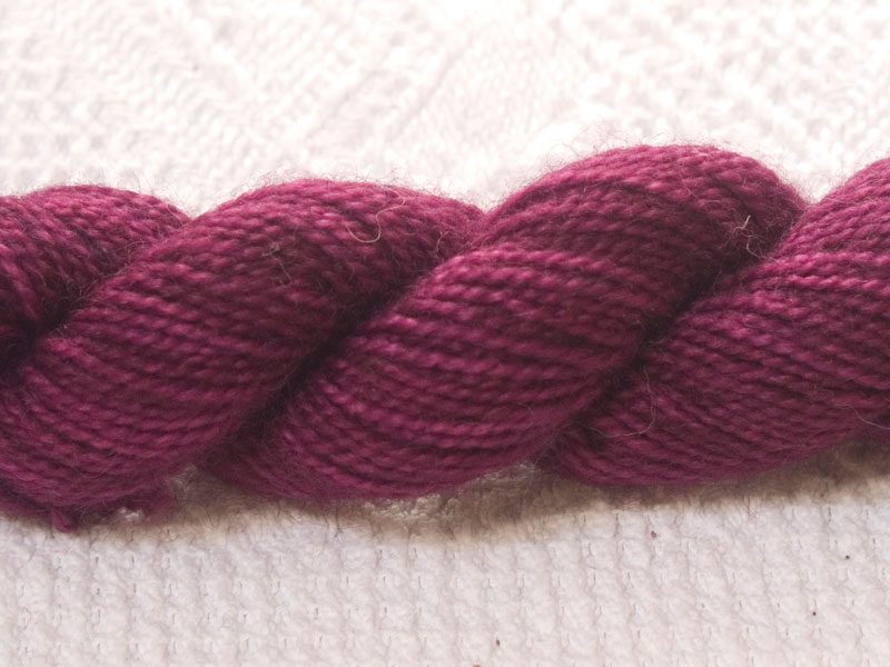 Freo - Semi-solid deep red-violet superwash Bluefaced Leicester (BFL) 4-ply/fingering/sock yarn mini skein. Hand-dyed by Triskelion Yarn