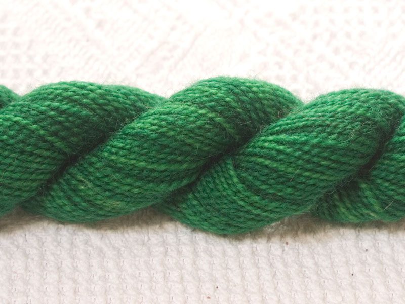 Nemeton - Mid-tone emerald green superwash Bluefaced Leicester (BFL) 4-ply/fingering/sock yarn mini skein. Hand-dyed by Triskelion Yarn