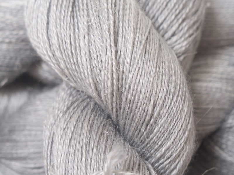Light to mid neutral grey Baby Alpaca, silk and linen heavy laceweight yarn. Hand-dyed by Triskelion Yarn.