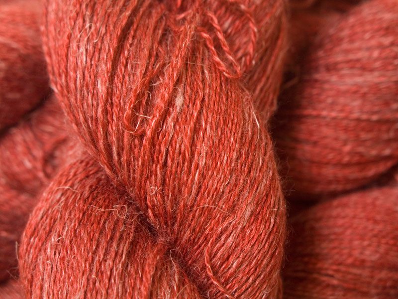 Fiery orange-red Baby Alpaca, silk and linen heavy laceweight yarn. Hand-dyed by Triskelion Yarn.