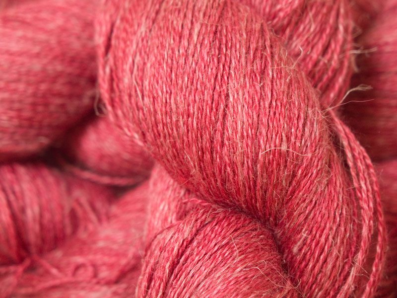Semi-solid deep rose Baby Alpaca, silk and linen heavy laceweight yarn. Hand-dyed by Triskelion Yarn.