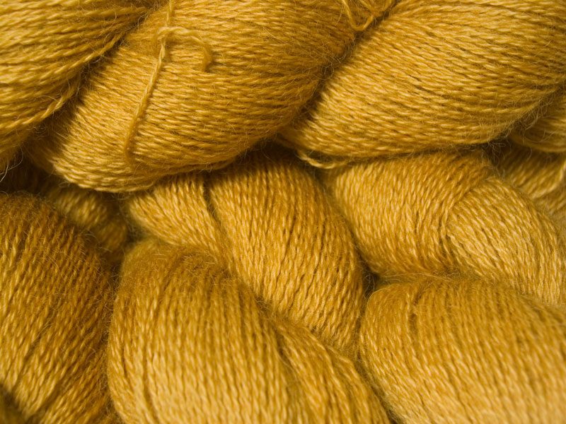 Warm yellow hand-dyed Wensleydale DK/ Double Knit yarn. Hand-dyed by Triskelion Yarn