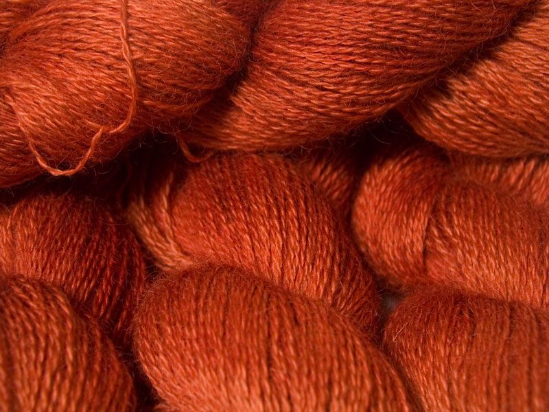 Fiery orange hand-dyed Wensleydale DK/ Double Knit yarn. Hand-dyed by Triskelion Yarn