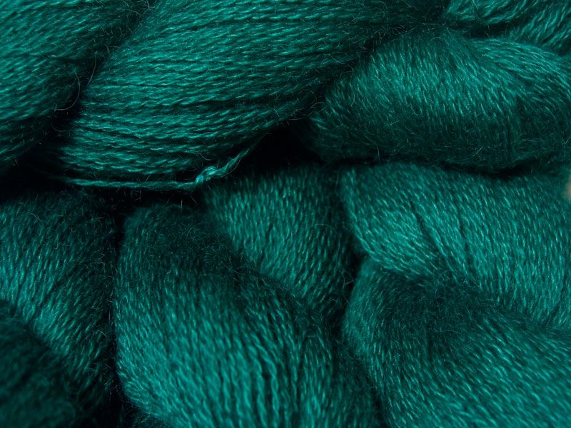 Mid to dark bluish-green hand-dyed Wensleydale DK/ Double Knit yarn. Hand-dyed by Triskelion Yarn