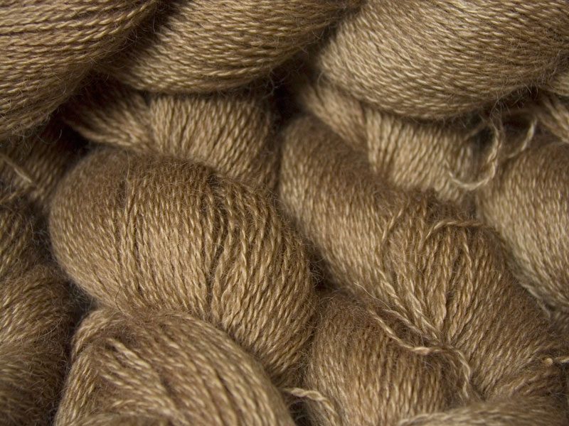 Reddish golden brown hand-dyed Wensleydale DK/ Double Knit yarn. Hand-dyed by Triskelion Yarn