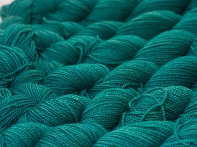 Mid-toned teal green superwash Bluefaced Leicester (BFL) 4-ply/fingering/sock yarn. Hand-dyed by Triskelion Yarn