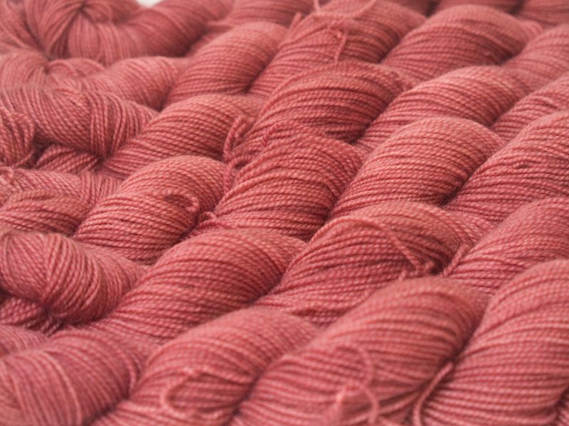 Semi-solid vibrant rose pink superwash Bluefaced Leicester (BFL) 4-ply/fingering/sock yarn. Hand-dyed by Triskelion Yarn
