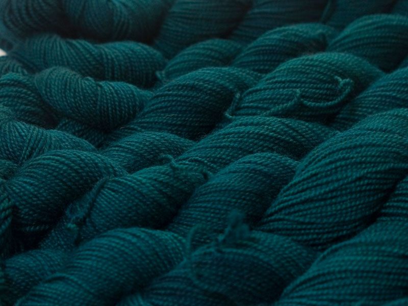 Mid to dark teal green superwash Bluefaced Leicester (BFL) 4-ply/fingering/sock yarn. Hand-dyed by Triskelion Yarn