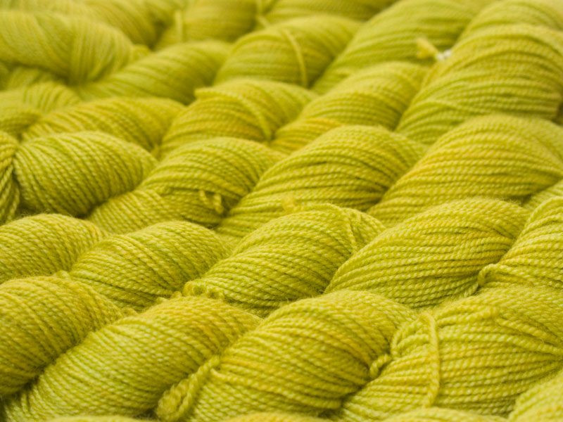 Semi-solid vibrant spring green superwash Bluefaced Leicester (BFL) 4-ply/fingering/sock yarn. Hand-dyed by Triskelion Yarn