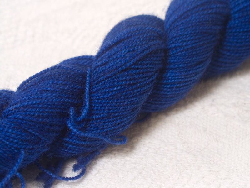 Semi-solid deep blue superwash Bluefaced Leicester (BFL) 4-ply/fingering/sock yarn. Hand-dyed by Triskelion Yarn