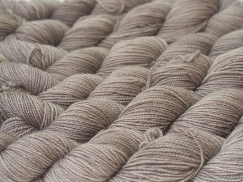Light pebble greyish brown superwash Bluefaced Leicester (BFL) 4-ply/fingering/sock yarn. Hand-dyed by Triskelion Yarn