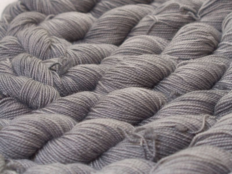 Light to mid grey superwash Bluefaced Leicester (BFL) 4-ply/fingering/sock yarn. Hand-dyed by Triskelion Yarn