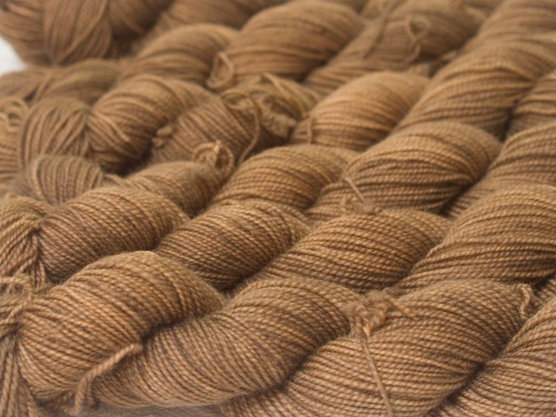 Reddish golden brown superwash Bluefaced Leicester (BFL) 4-ply/fingering/sock yarn. Hand-dyed by Triskelion Yarn