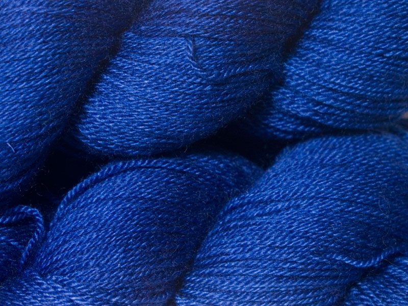 Semi-solid deep blue Bluefaced Leicester, silk & cashmere 4-ply yarn. Hand-dyed by Triskelion Yarn.