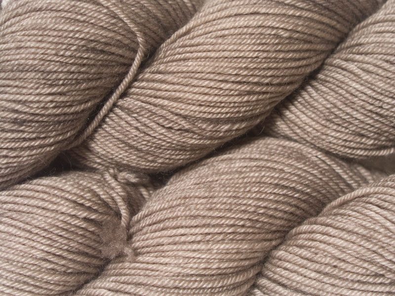 Light pebble grey Bluefaced Leicester, silk & cashmere double knit yarn. Hand-dyed by Triskelion Yarn.