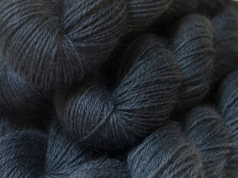 Semi-solid mid to dark grey, with tones of stormy blue and violet hand-dyed Wensleydale DK/ Double Knit yarn. Hand-dyed by Triskelion Yarn