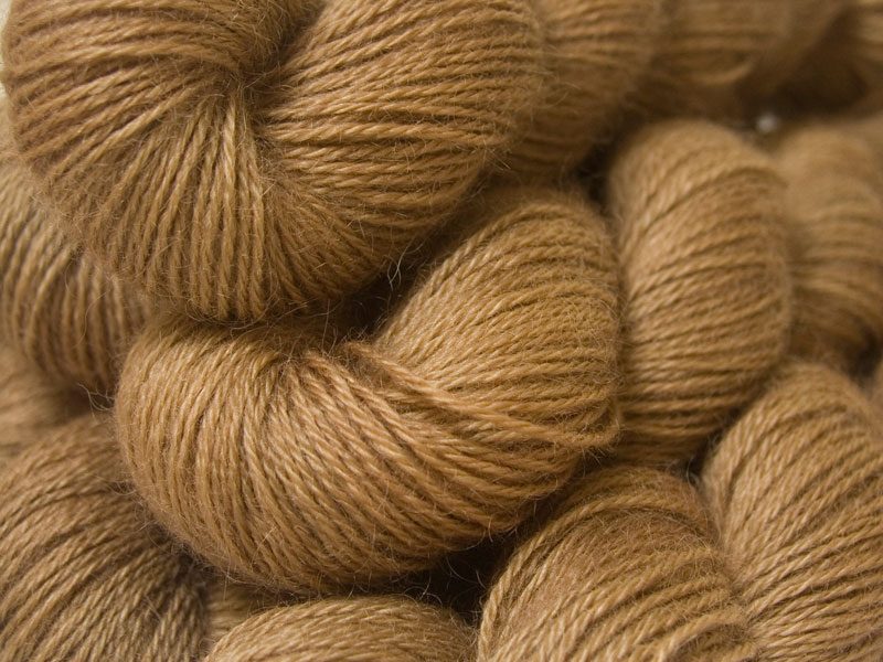 Semi-solid light brown, with oakwood and tawny tones hand-dyed Wensleydale DK/ Double Knit yarn. Hand-dyed by Triskelion Yarn