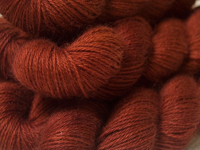 Semi-solid dark orange, with tones of copper, vermillion and russet hand-dyed Wensleydale DK/ Double Knit yarn. Hand-dyed by Triskelion Yarn