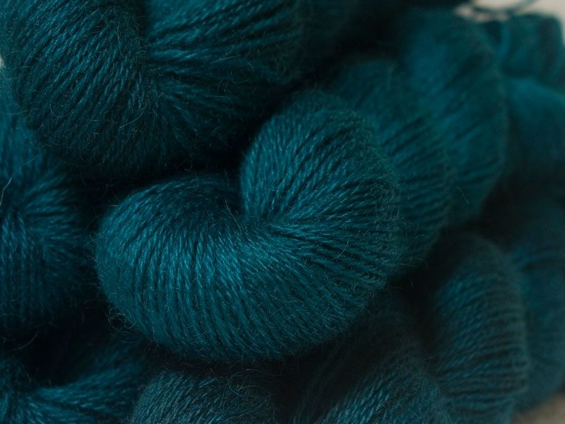 Semi-solid dark sea blue, with petrol blue, teal and sea green tones hand-dyed Wensleydale DK/ Double Knit yarn. Hand-dyed by Triskelion Yarn